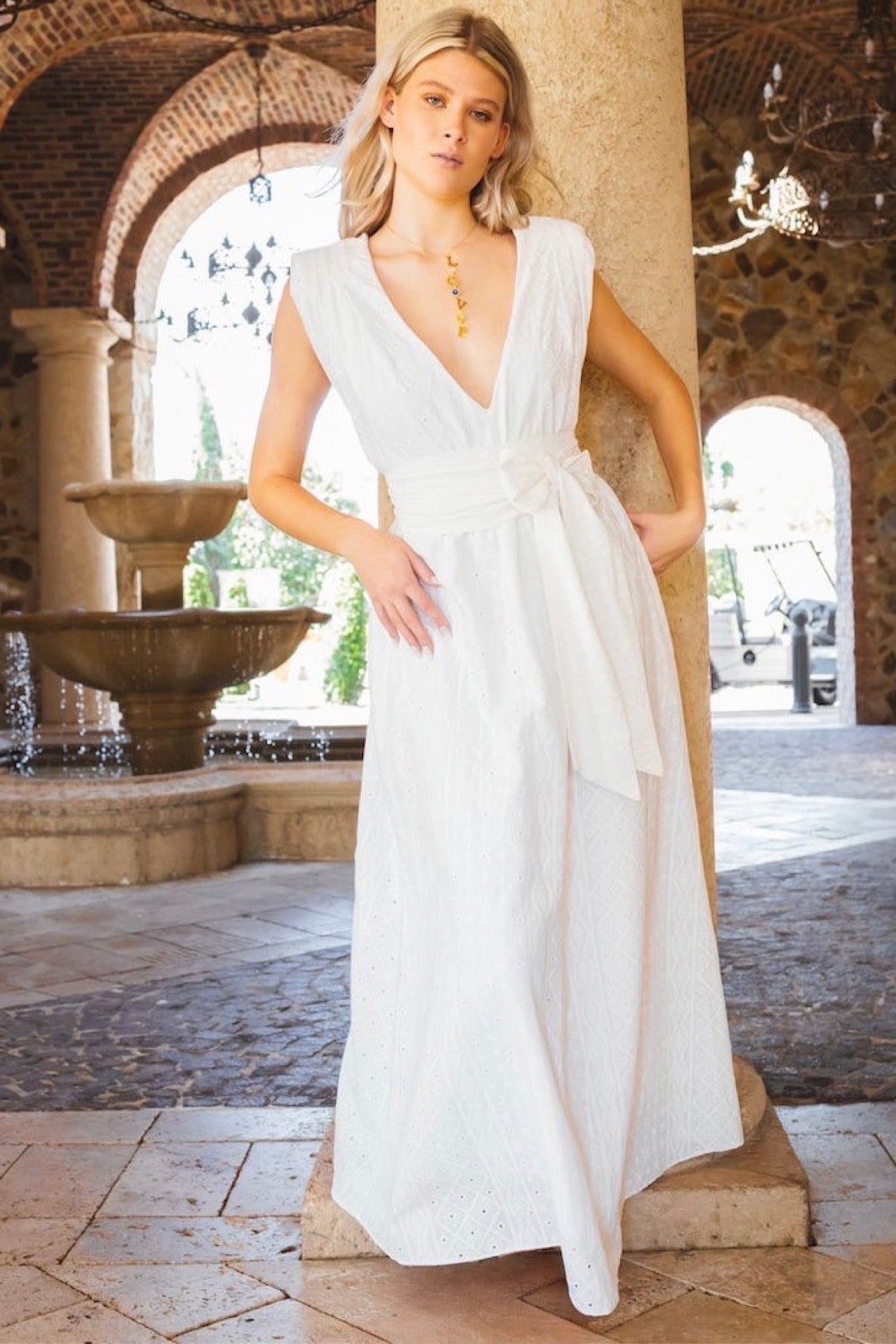 Fully lined dress with a V-neck, empire waist belt, intricate embroidery, 100% cotton with a linen effect, and pockets