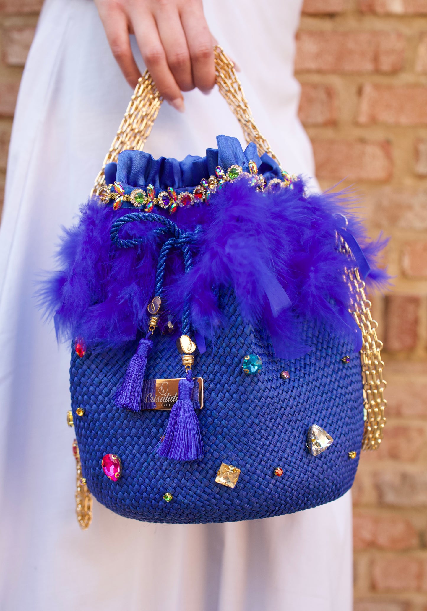 Ella Straw Bucket Bag with crystal detailing and 18k gold hardware, made from 100% Iraca palm