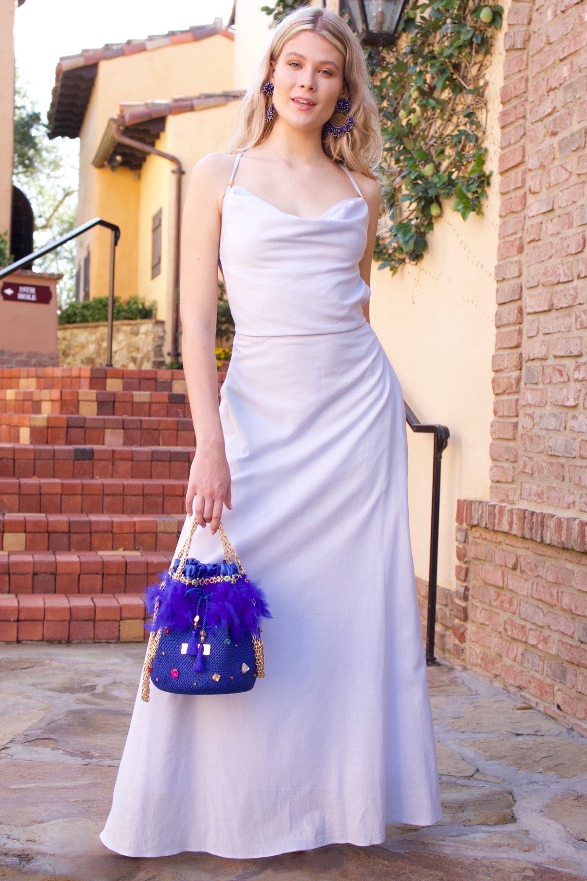 Fully lined dress crafted from luxurious linen with adjustable straps and practical pockets
