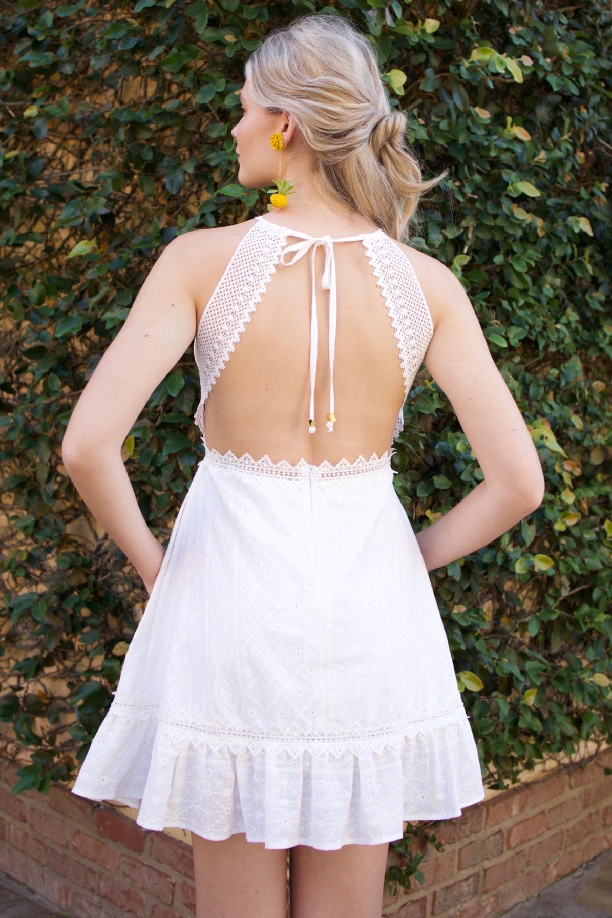 100% cotton dress with guipure detailing, lined for comfort, and a flowing hem