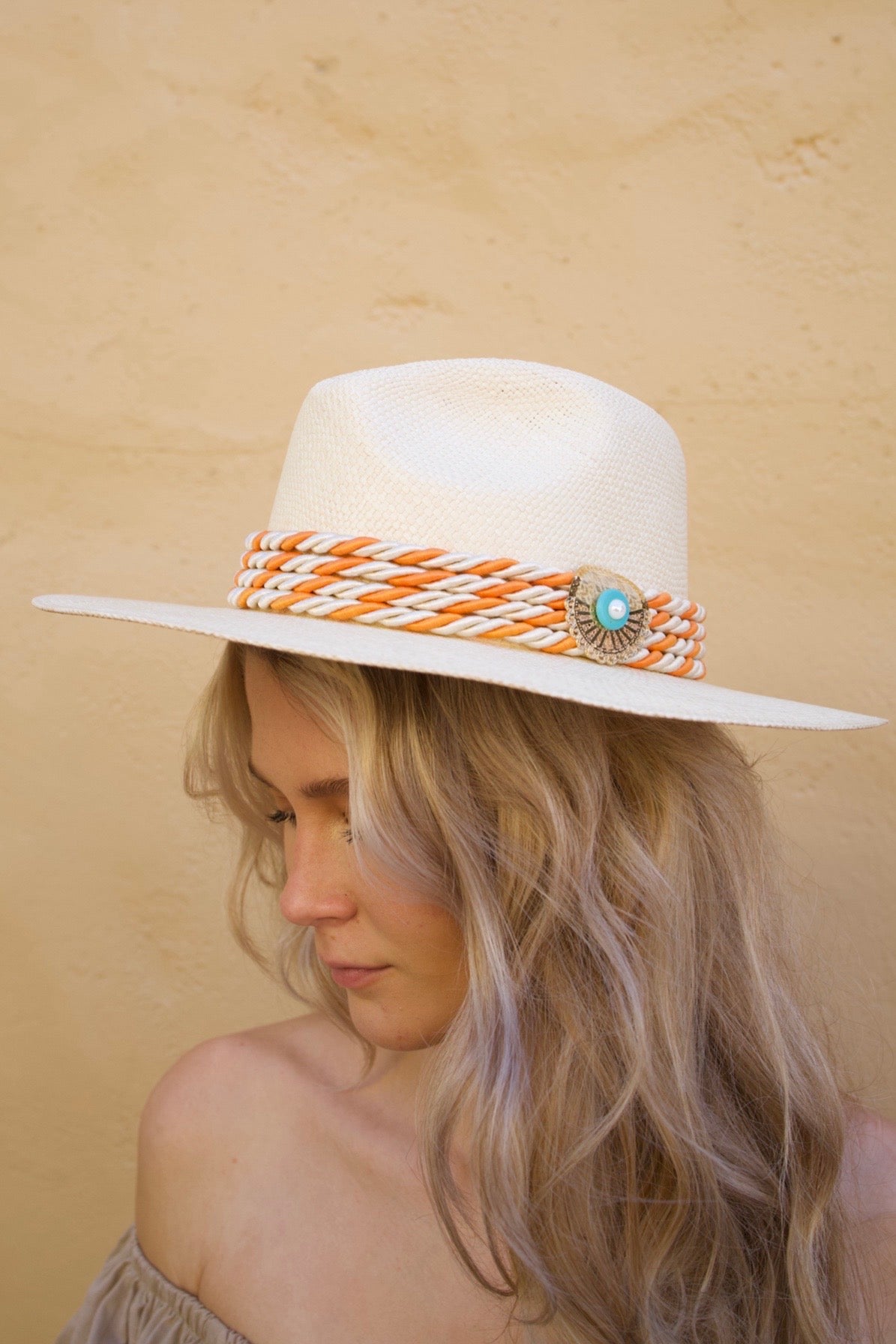 Monaco Hat made from 100% Iraca palm with 24K gold-plated plaque and handwoven silk cord. 55cm diameter