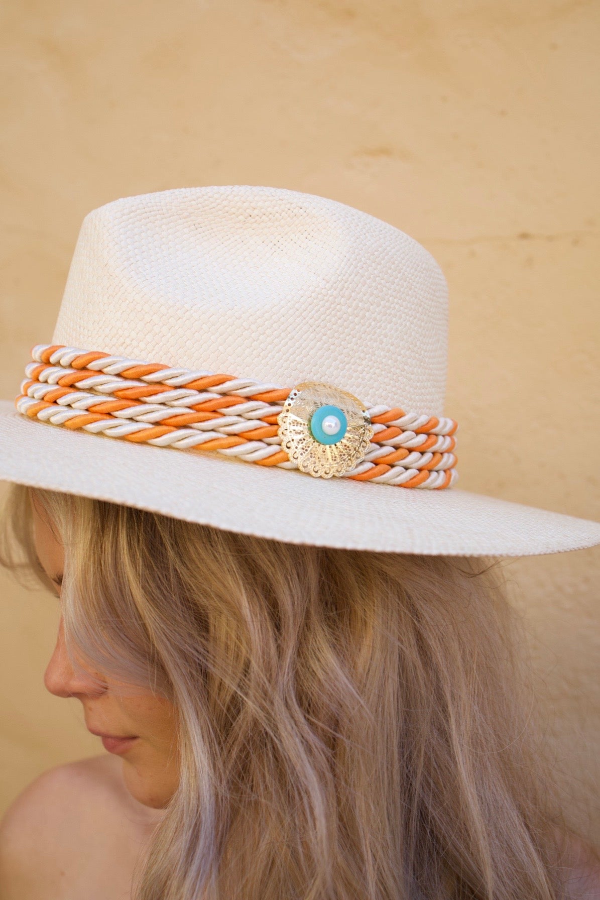 Monaco Hat made from 100% Iraca palm with 24K gold-plated plaque and handwoven silk cord. 21 inch diameter