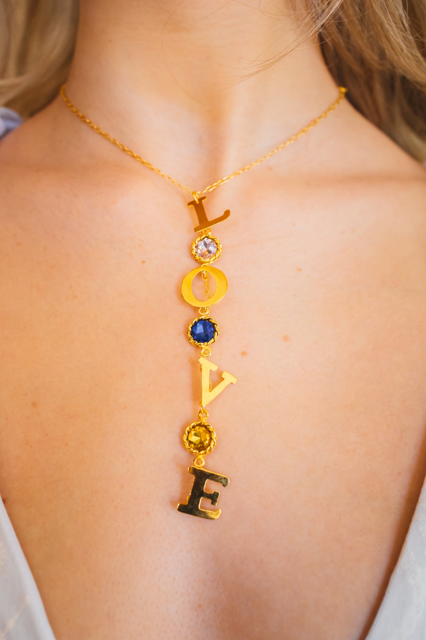 LOVE Necklace dipped in 24K gold, with Swarovski crystals and protective lacquer for lasting shine,