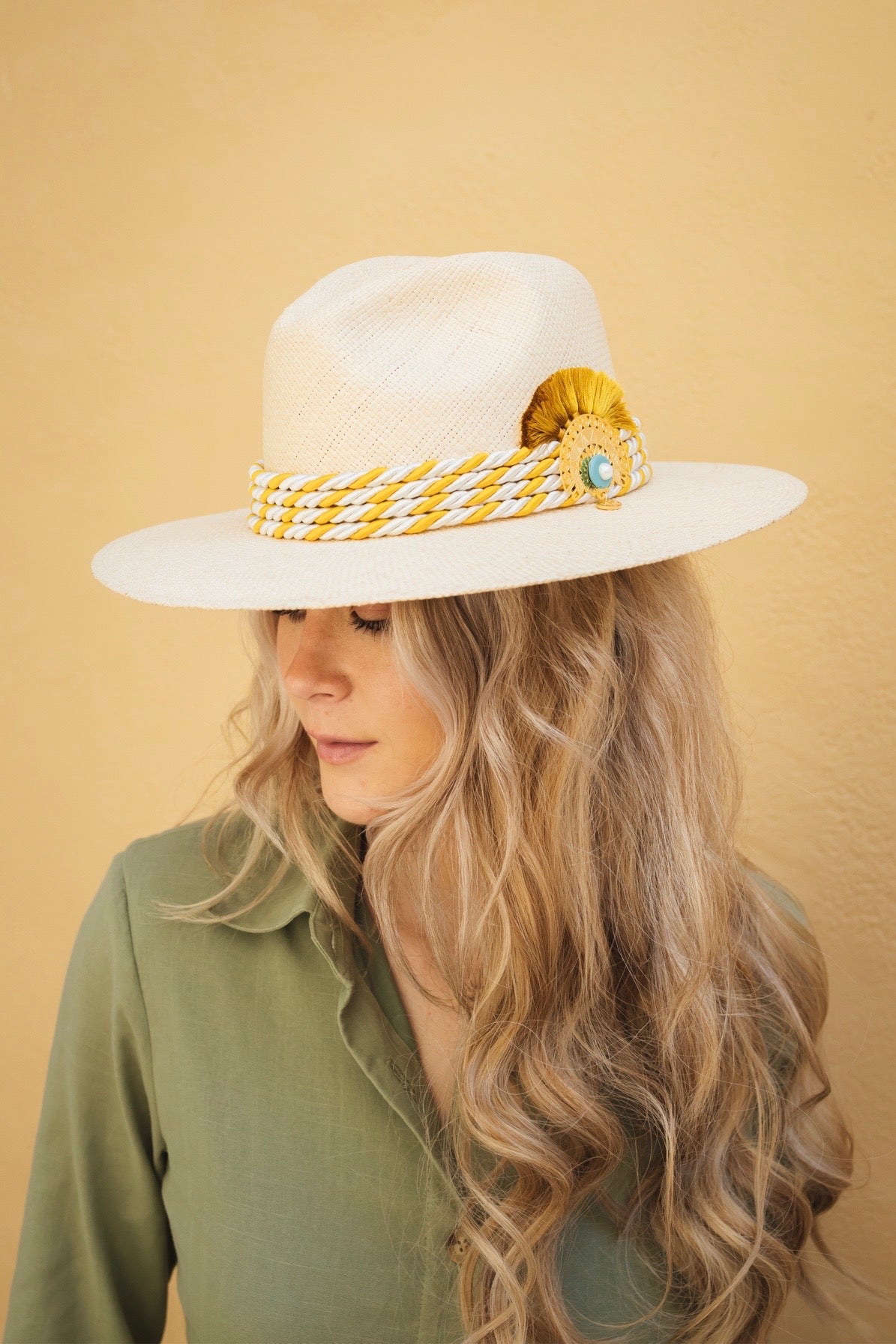 Monaco Hat made from 100% Iraca palm with 24K gold-plated plaque and handwoven silk cord.